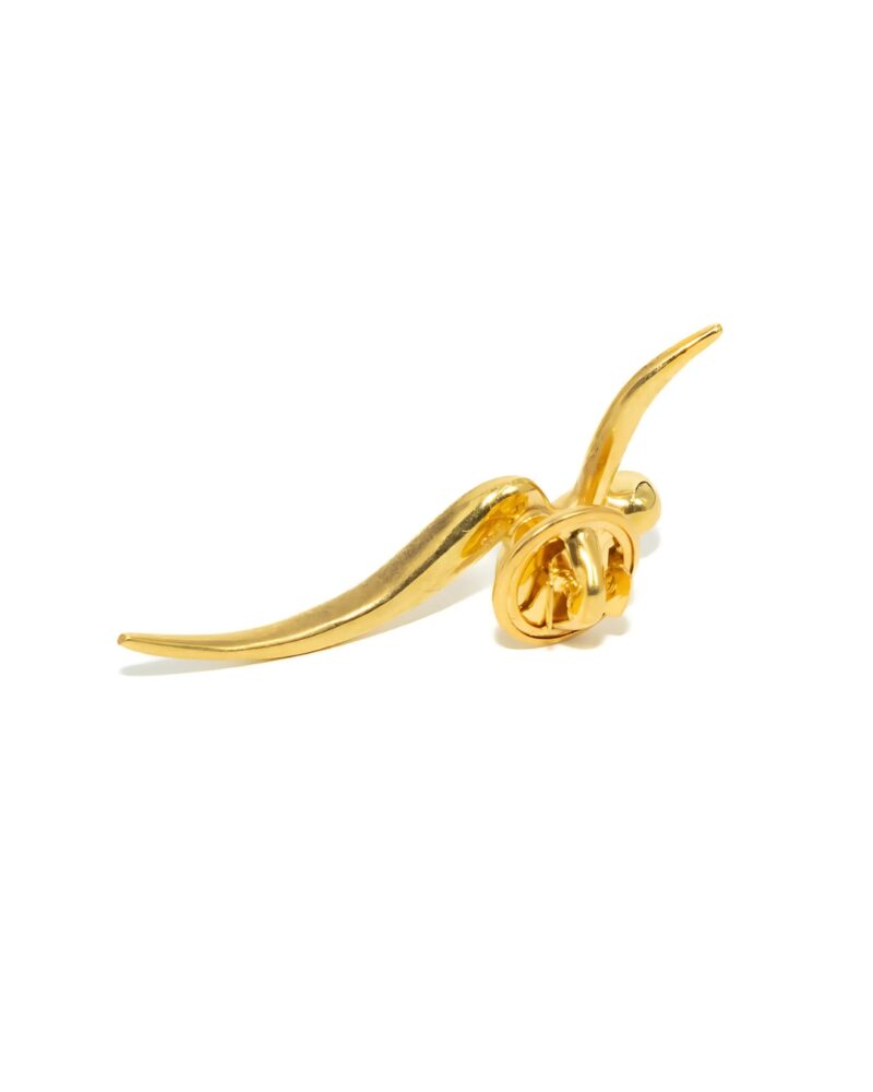 dora kounakis gold cufflinks behind charm 2025